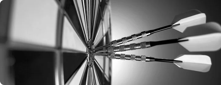 Darts striking the center of a target